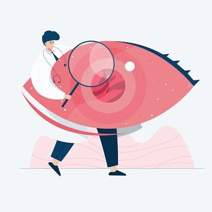 A doctor is examining an eye with a magnifying glass.
