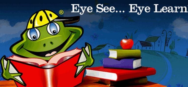 A frog is reading a book next to a stack of books