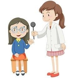 A girl is sitting on a chair while a doctor examines her eyes.