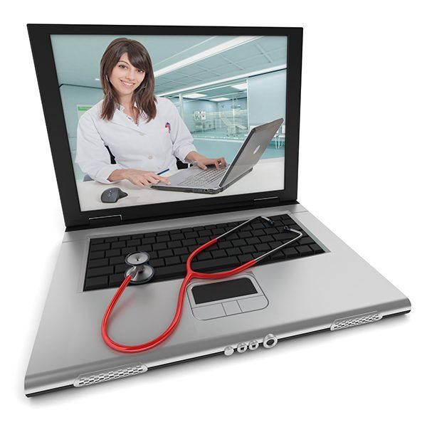 A laptop with a stethoscope attached to it and a doctor on the screen