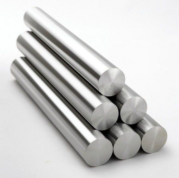 A stack of stainless steel bars stacked on top of each other on a white surface.