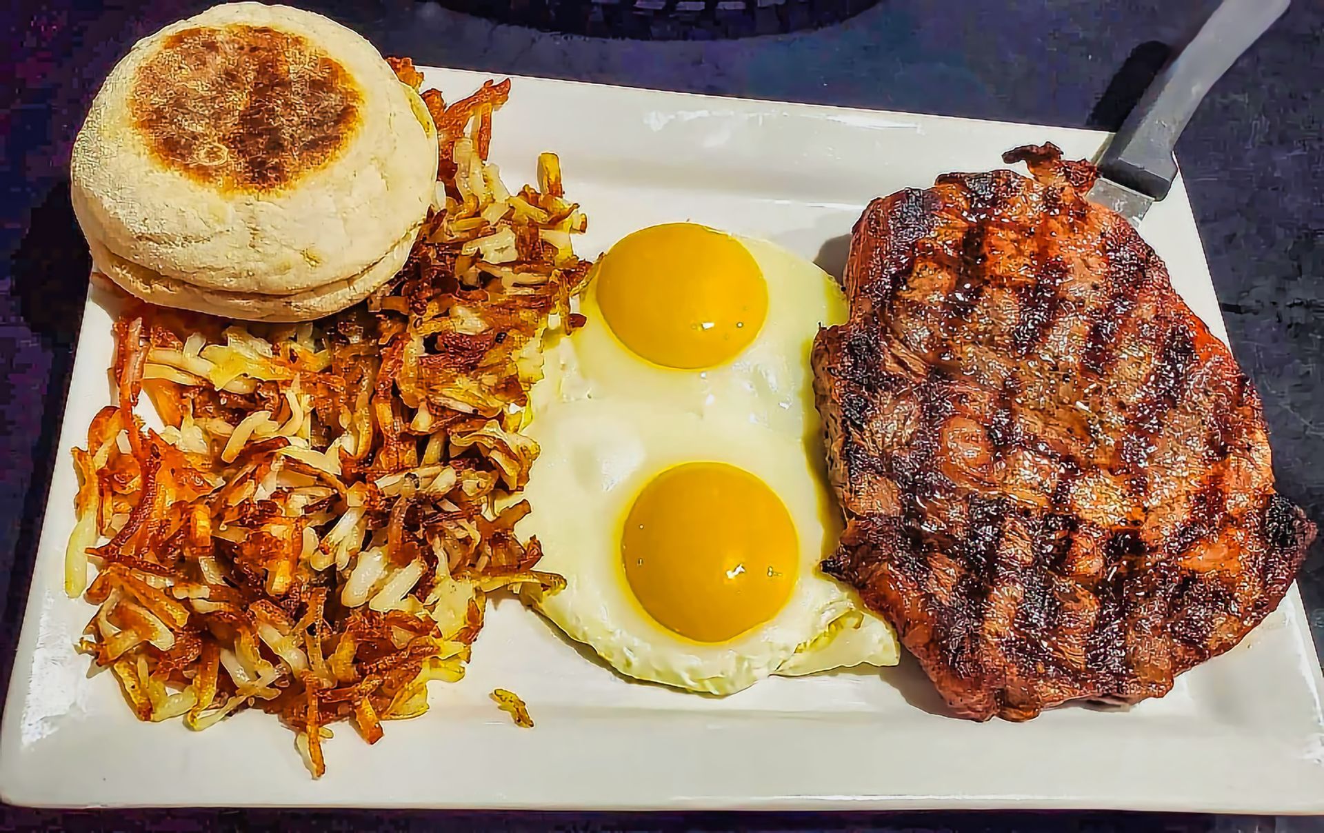 Steak and eggs breakfast plate at Ralph's