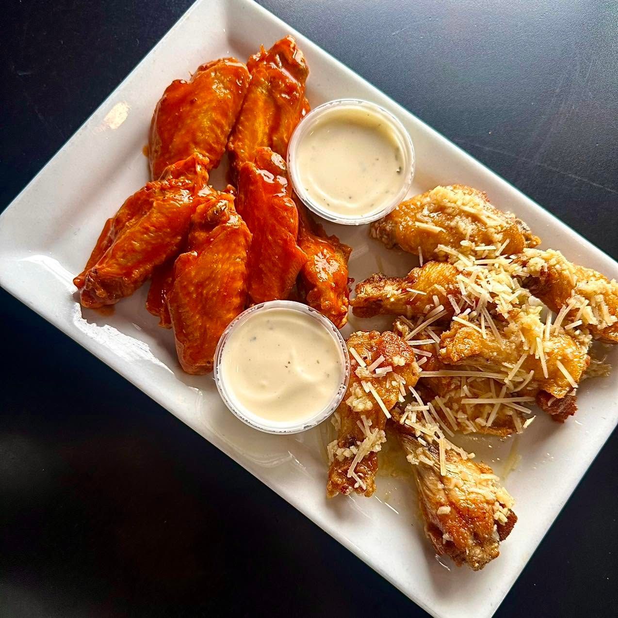 Buffalo and garlic parmesan wings at Ralph's Ace of Hearts