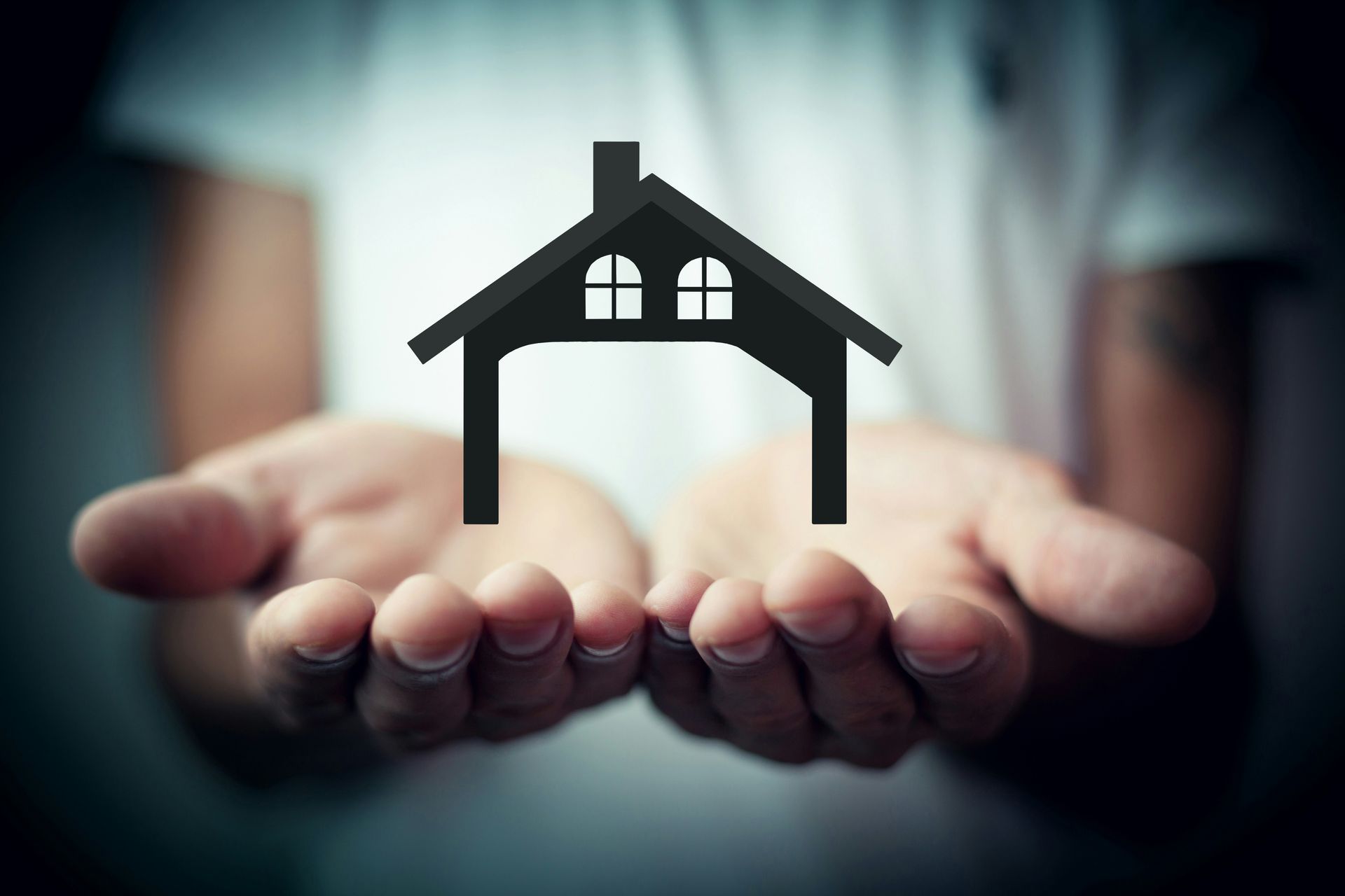 hands holding home