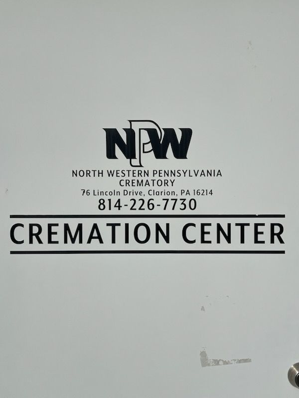 Sign for North Western Pennsylvania Crematory, includes logo, address, and phone number.