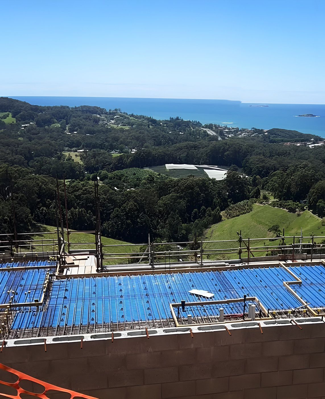 Scaffolded Construction Site Overlooking Coastline — Big River Scaffolding Solutions Pty Ltd in Gold Coast, QLD