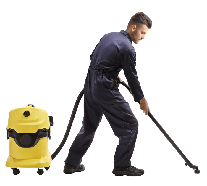 Worker vacuuming a white floor with a yellow wet-dry vacuum cleaner