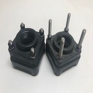 A pair of black rubber pads with screws on a white surface.