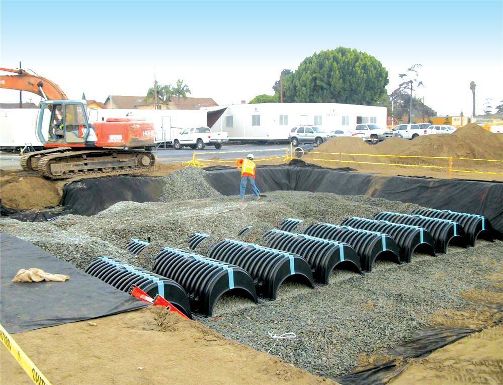 A construction site with a large excavator in the background