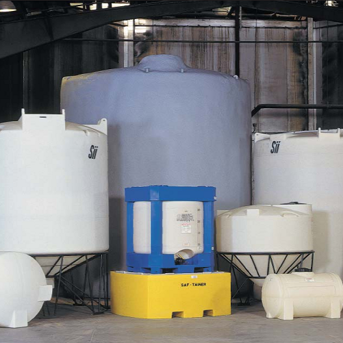 A bunch of white tanks are lined up in a warehouse