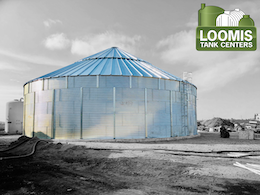 A large tank with a sign that says loomis tank centers