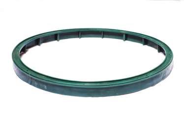 A green plastic ring on a white background.