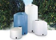 A group of plastic water tanks are sitting next to each other on a table.