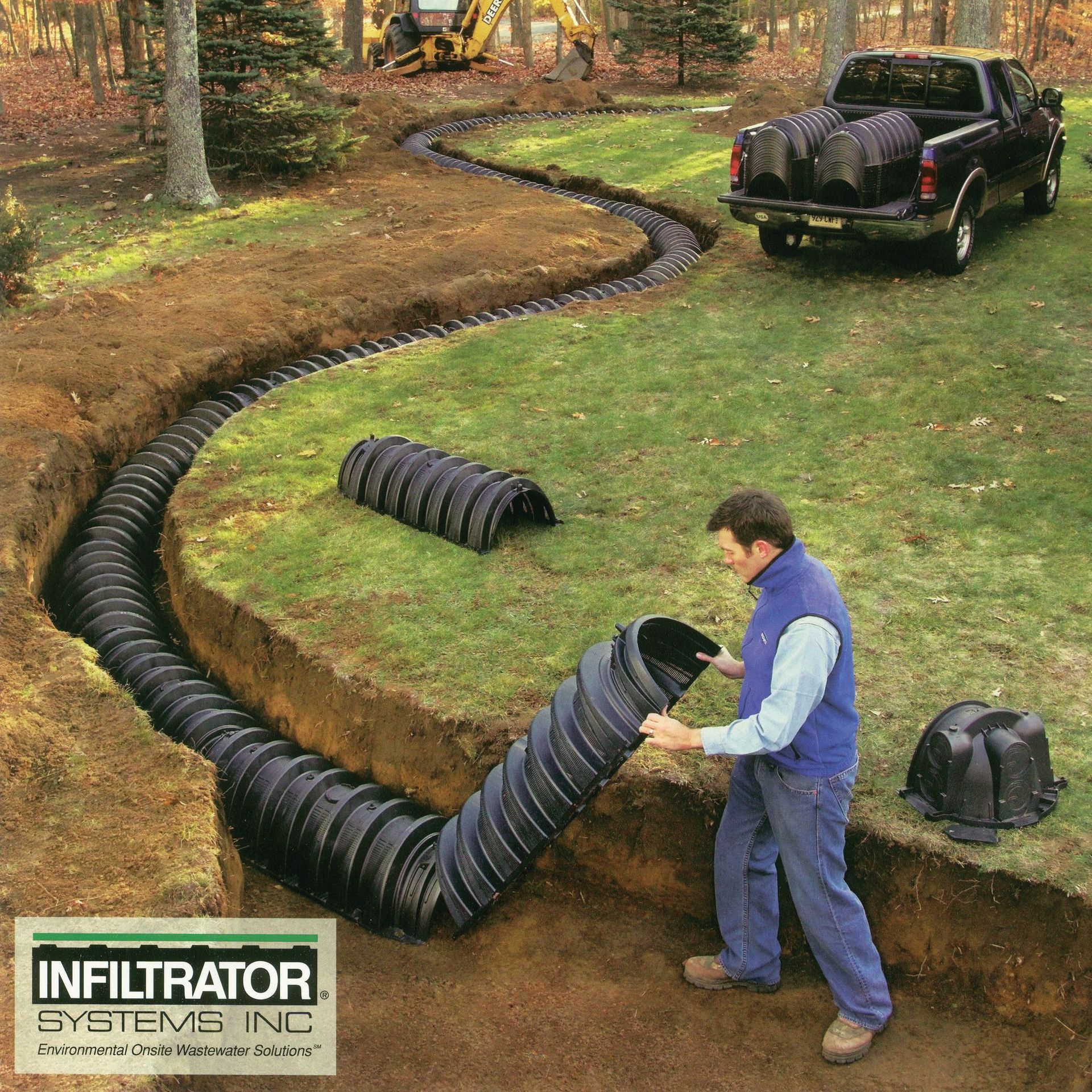 A man is working on a drainage system sponsored by infiltrator systems inc.