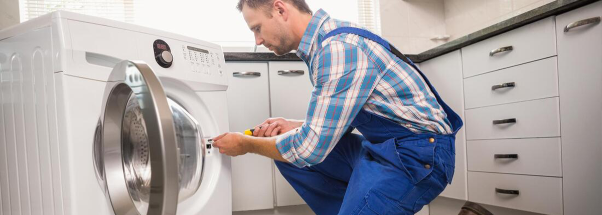 appliance repair technician fixing dryer in las vegas