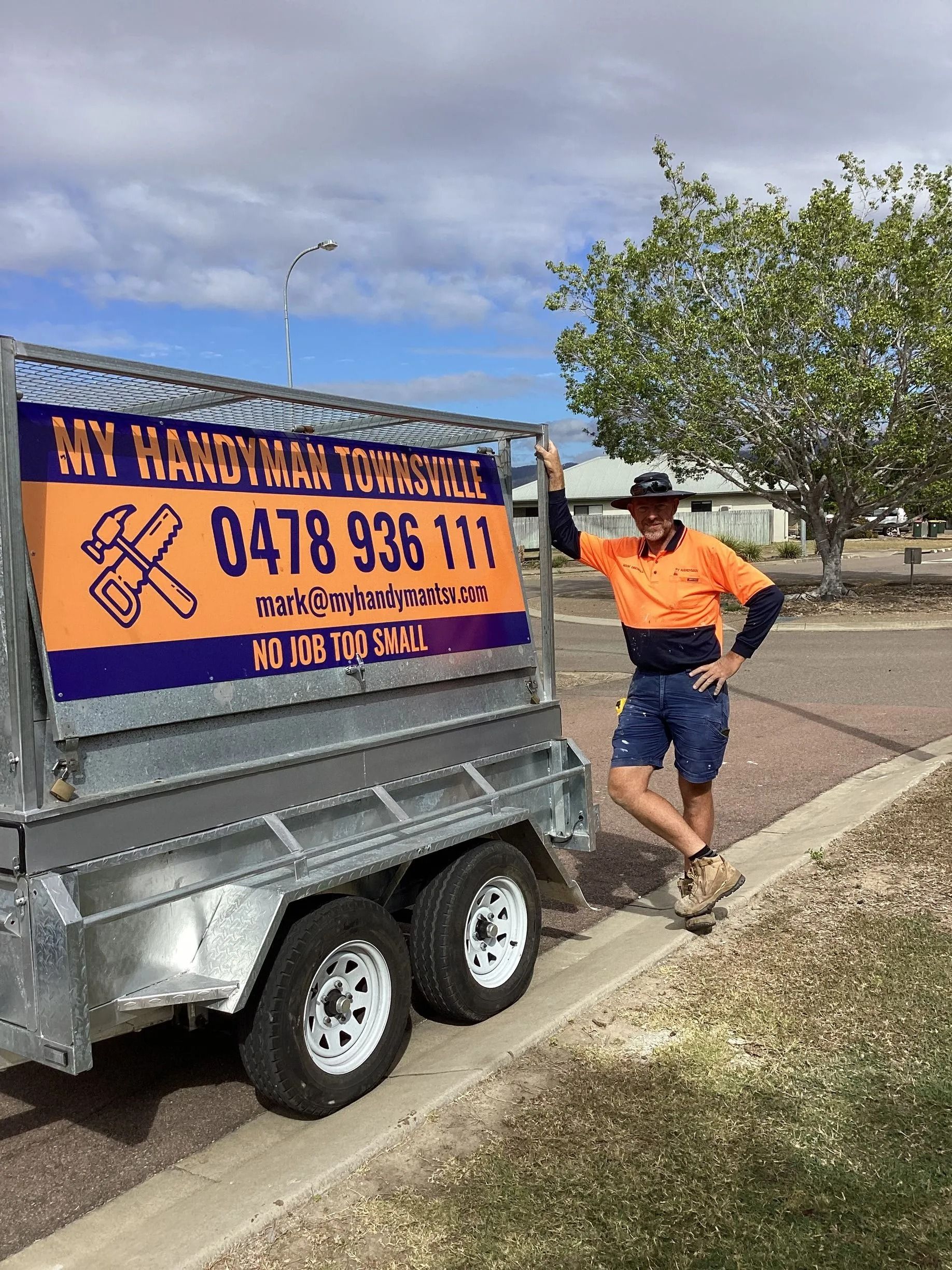Man Standing Next to a Trailer — My Handyman Townsville In Garbutt, QLD