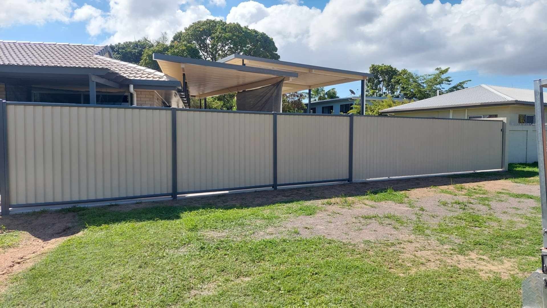 Gray Wooden Driveway Gate With Geometric Design — My Handyman Townsville In Garbutt, QLD