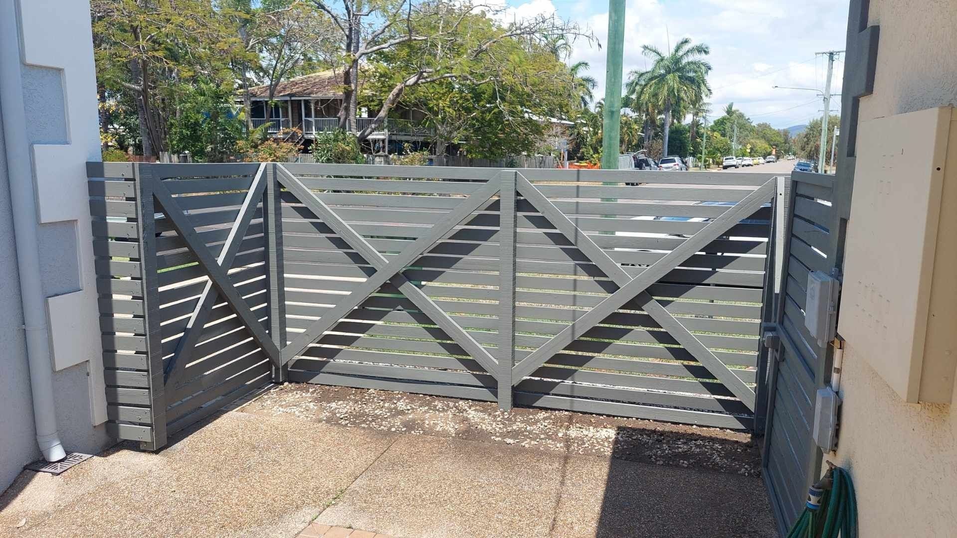 A Person Welding Metal Railing Outdoors — My Handyman Townsville In Garbutt, QLD