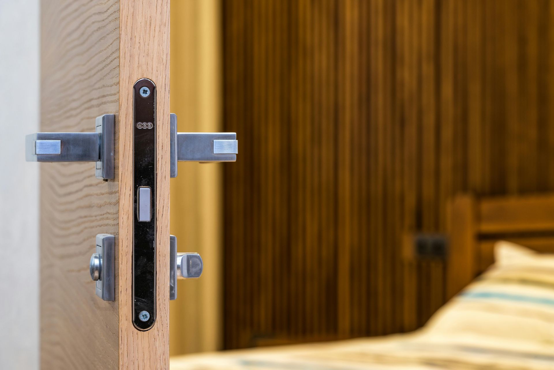 Close-up of a Silver Metal Door With a Modern Handle — My Handyman Townsville In Garbutt, QLD