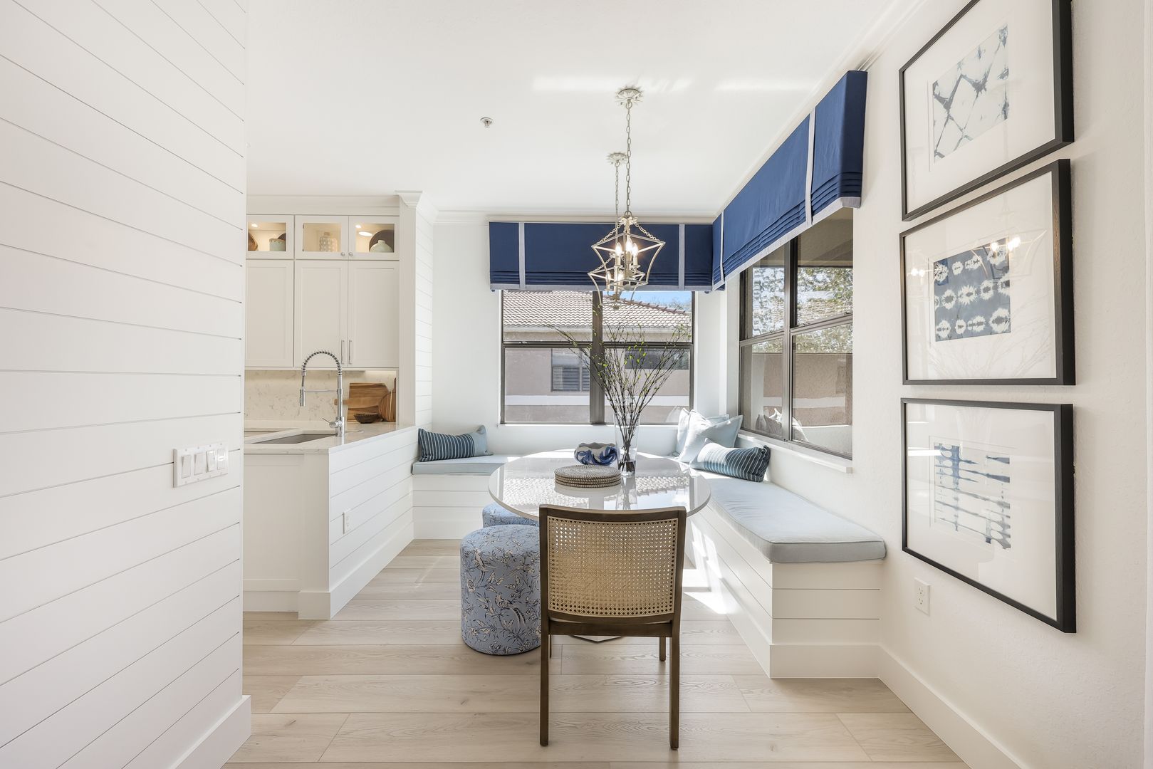 A dining room with a table and chairs in it