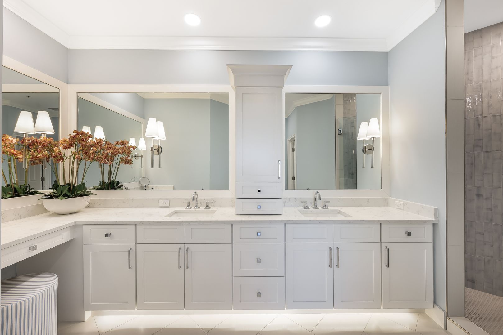 A bathroom with two sinks and two mirrors.