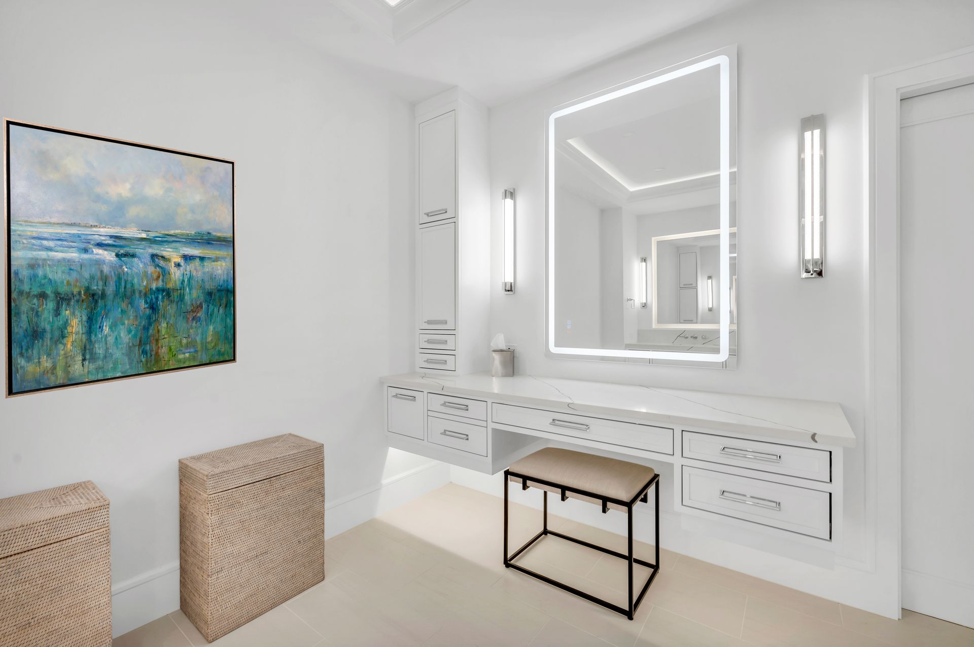 A bathroom with a large mirror and a painting on the wall.