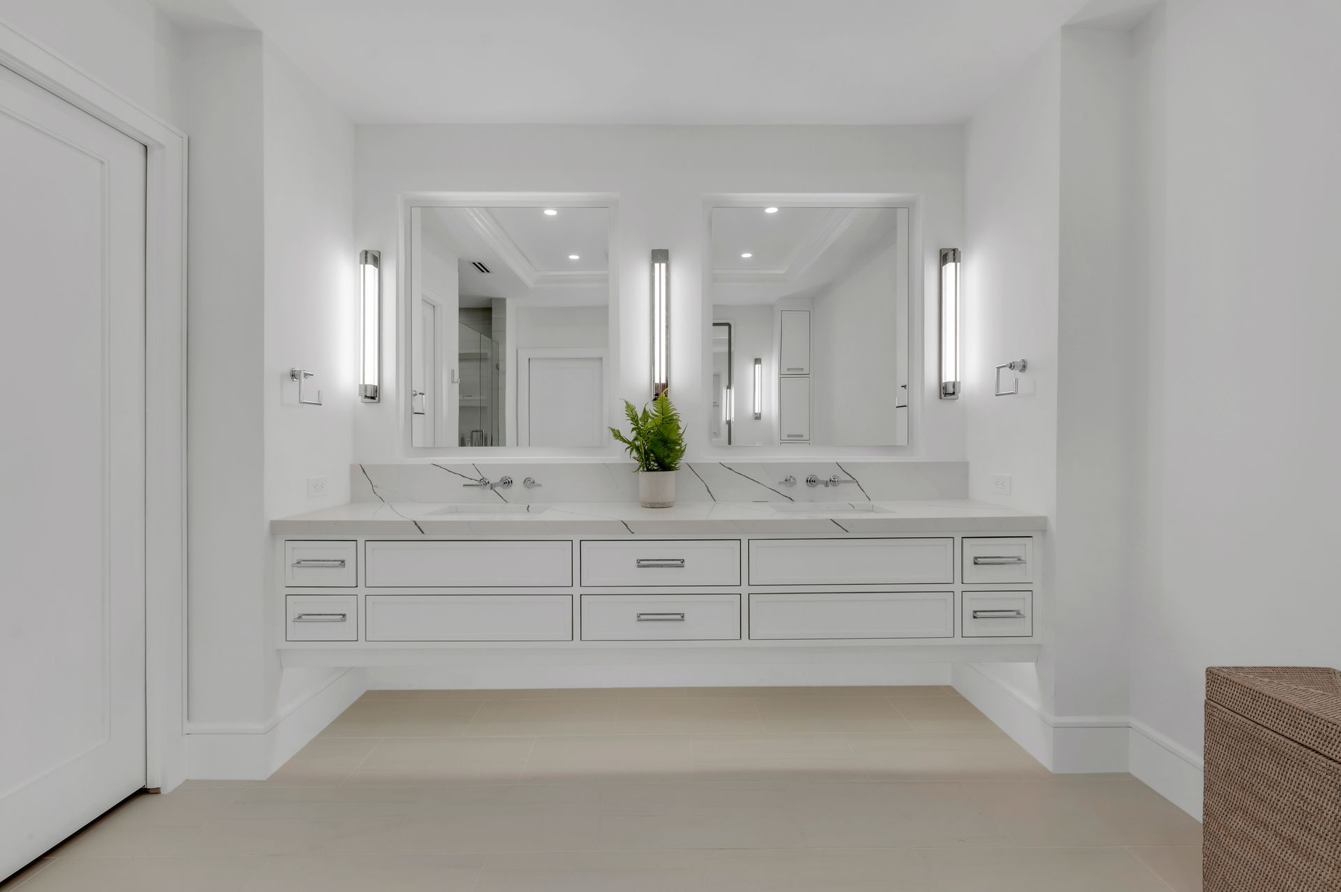 A bathroom with two sinks and two mirrors
