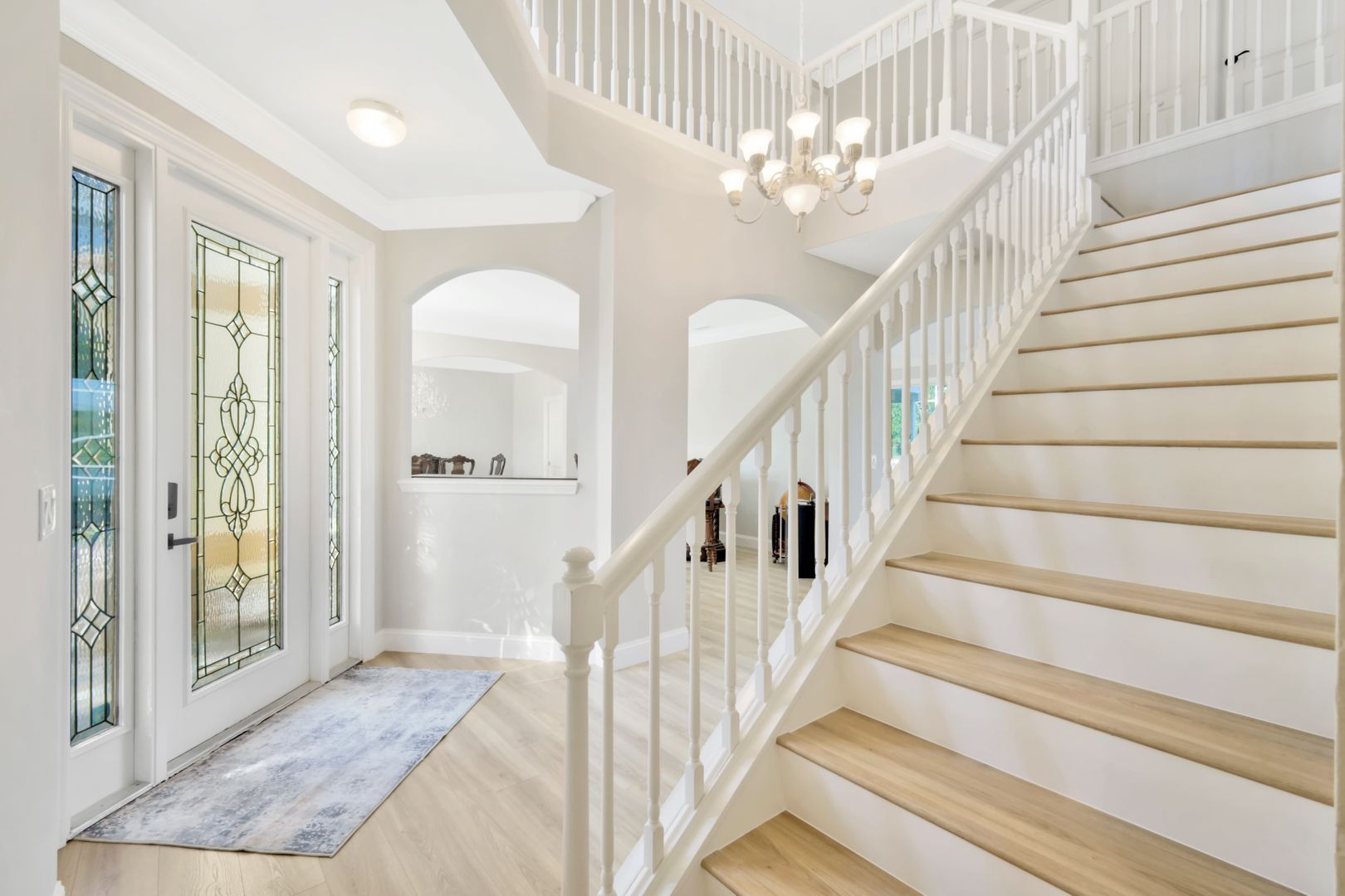 there is a staircase leading up to the second floor of a house .