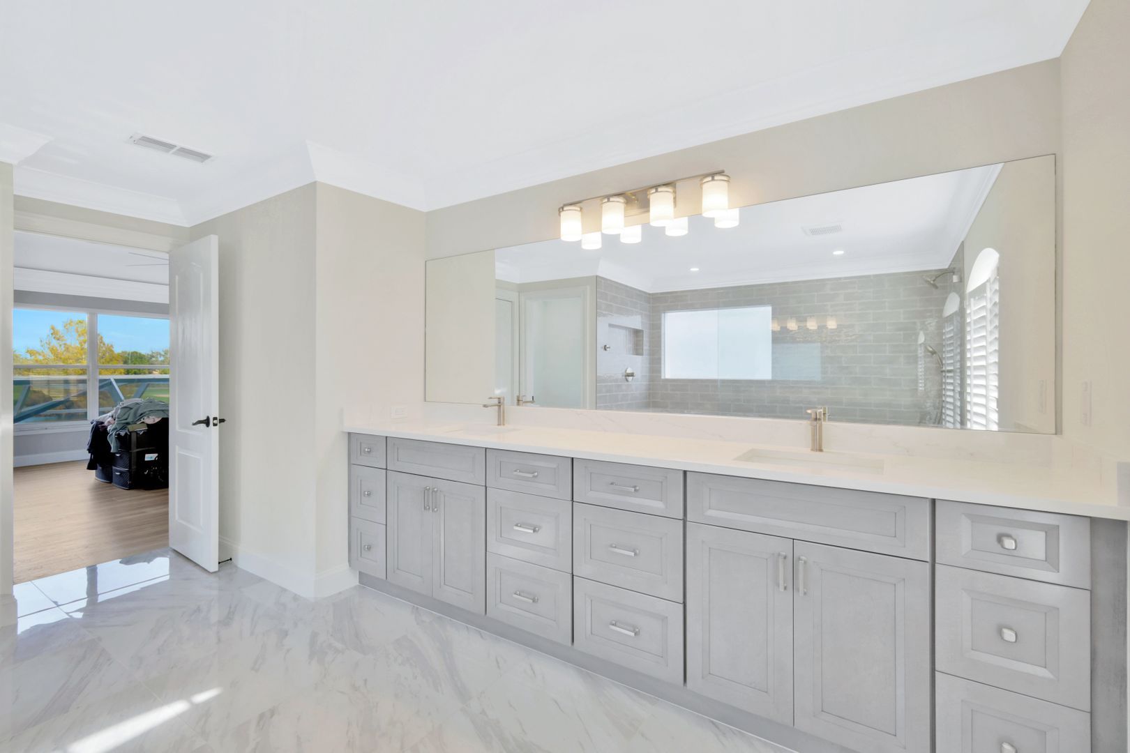 a bathroom with two sinks and a large mirror .