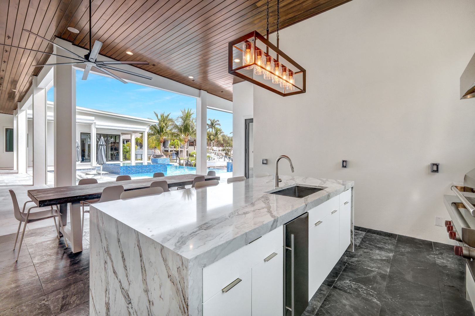 there is a large island in the middle of the kitchen .