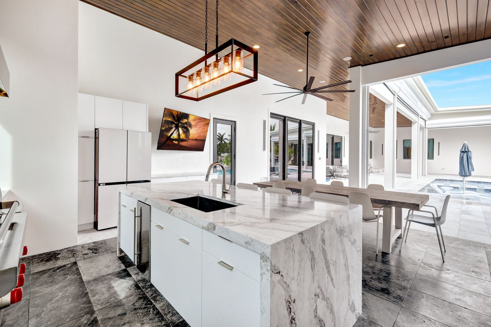 there is a large island in the middle of the kitchen .