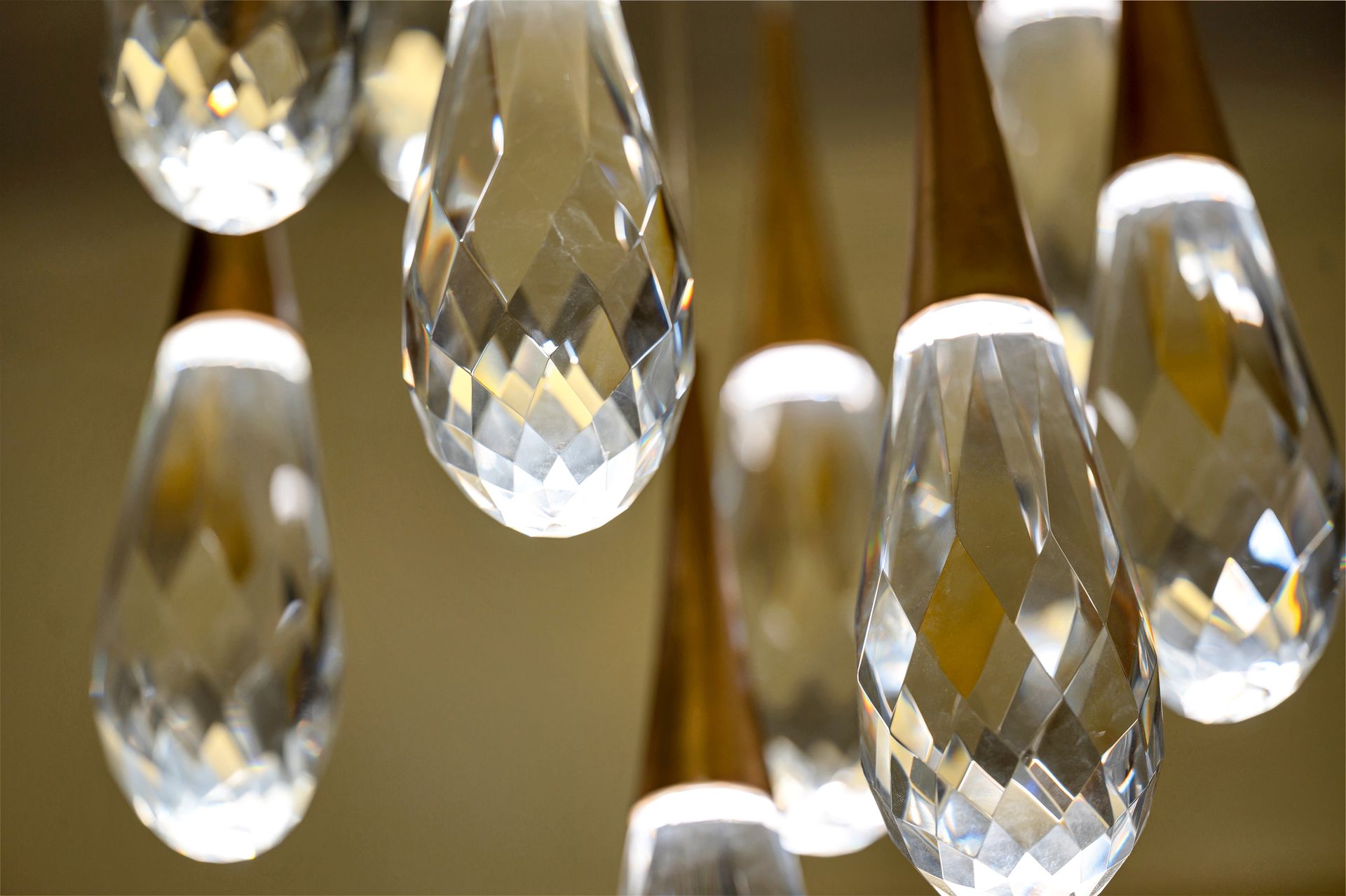 A close up of a bunch of crystals hanging from a ceiling.