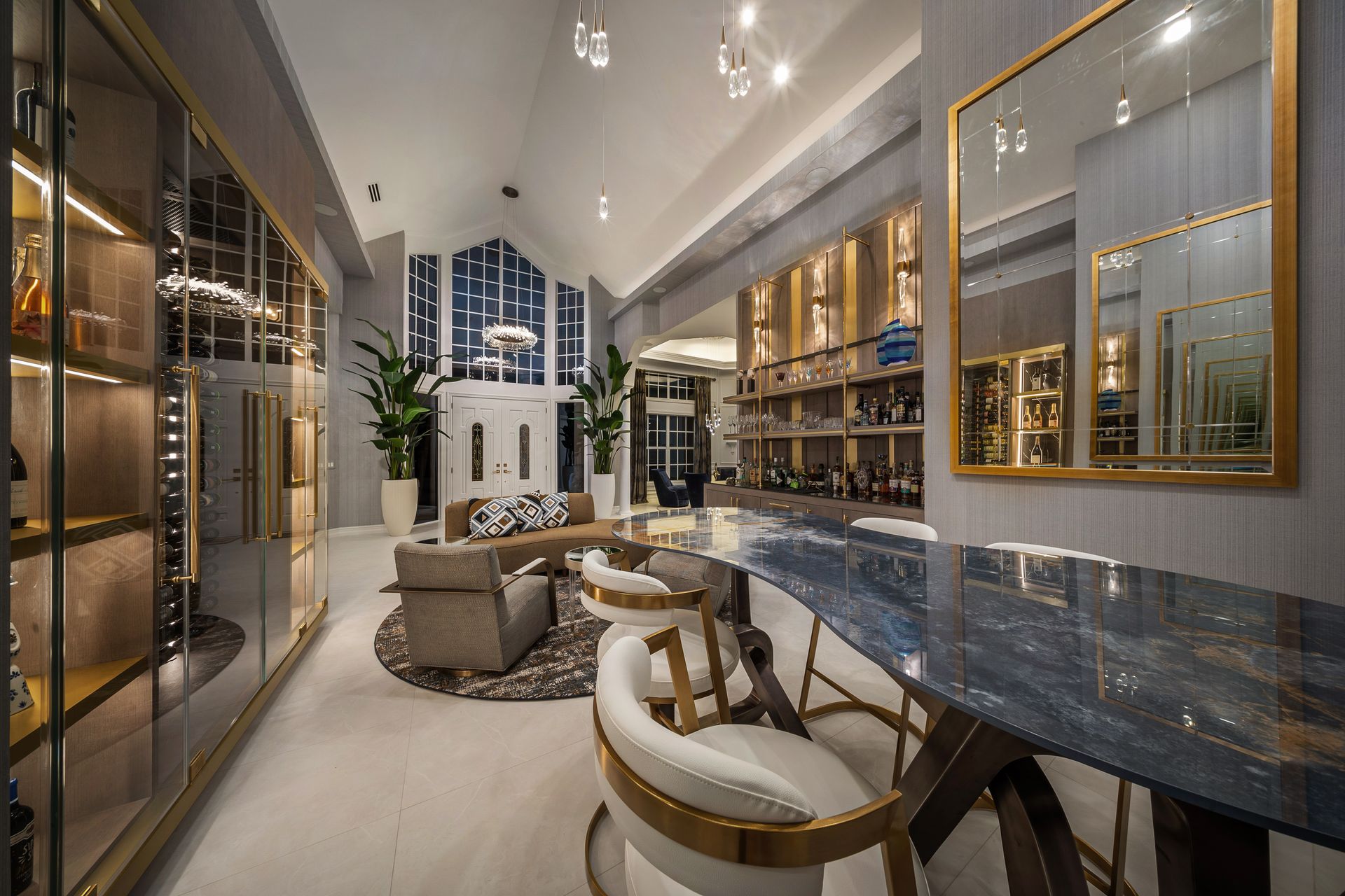 A living room with a table and chairs and a large mirror.