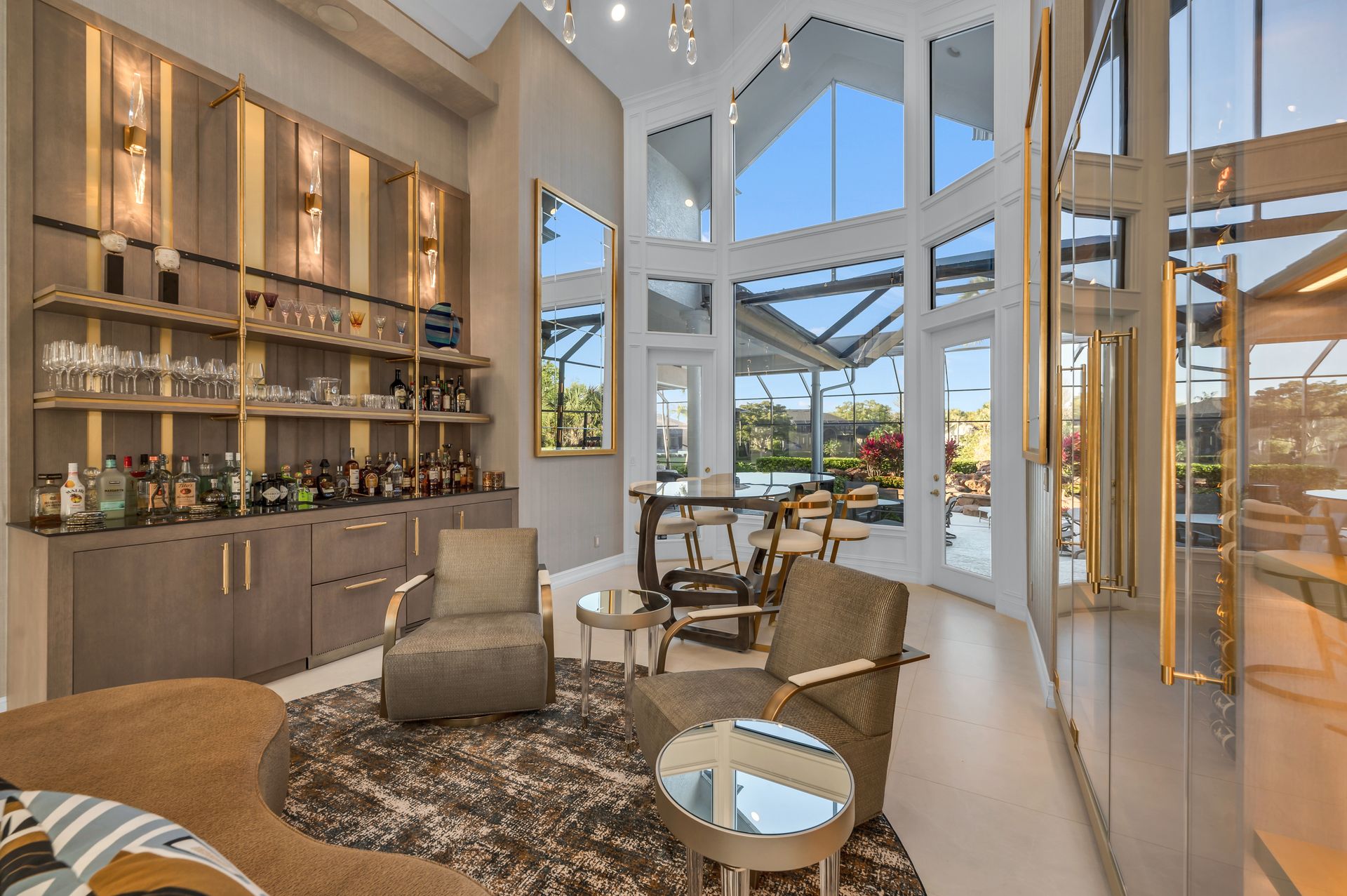A living room filled with furniture and a bar.