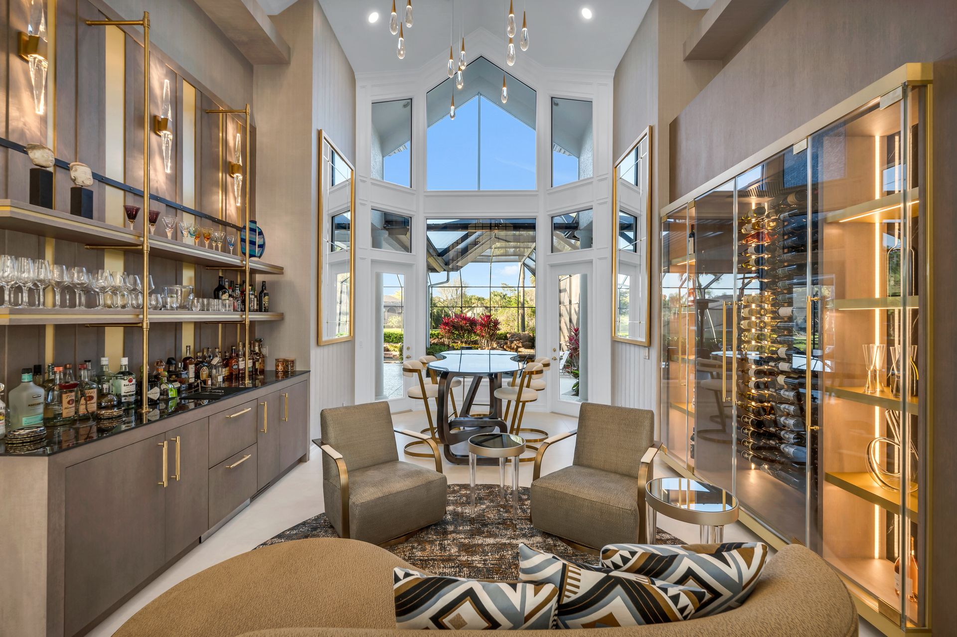 A living room filled with furniture and a bar.