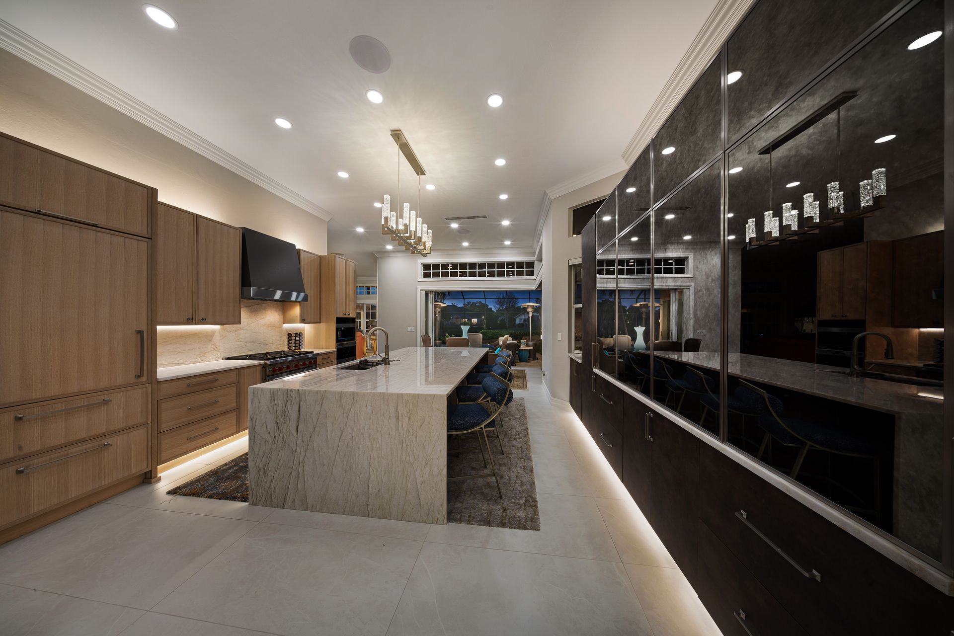 A kitchen with a large island in the middle of it