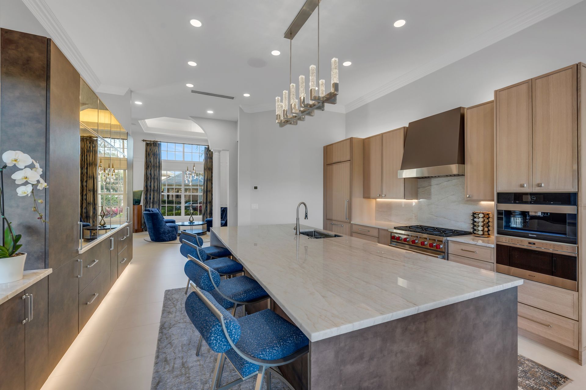 A kitchen with a large island and stools
