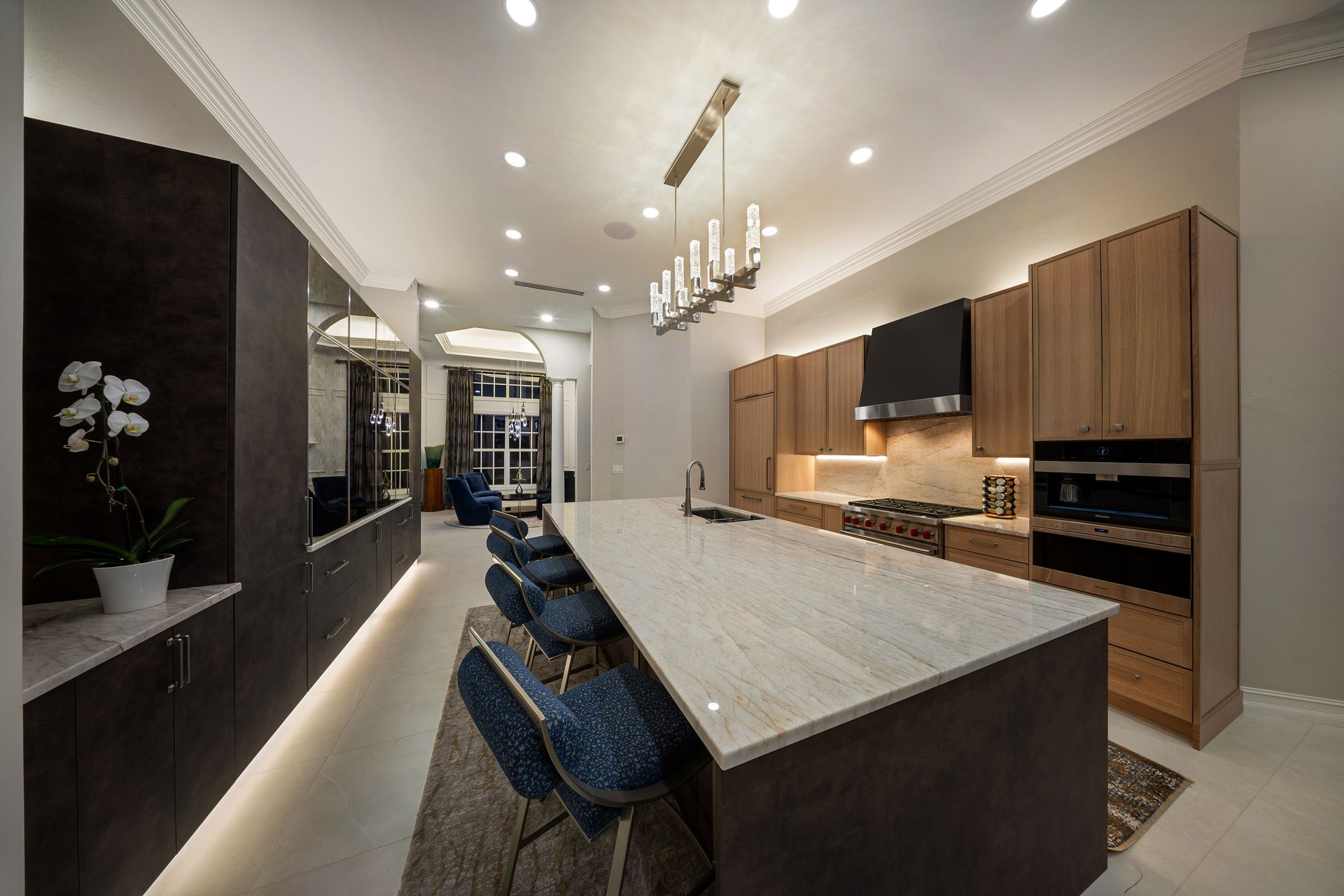 there is a large island in the middle of the kitchen .