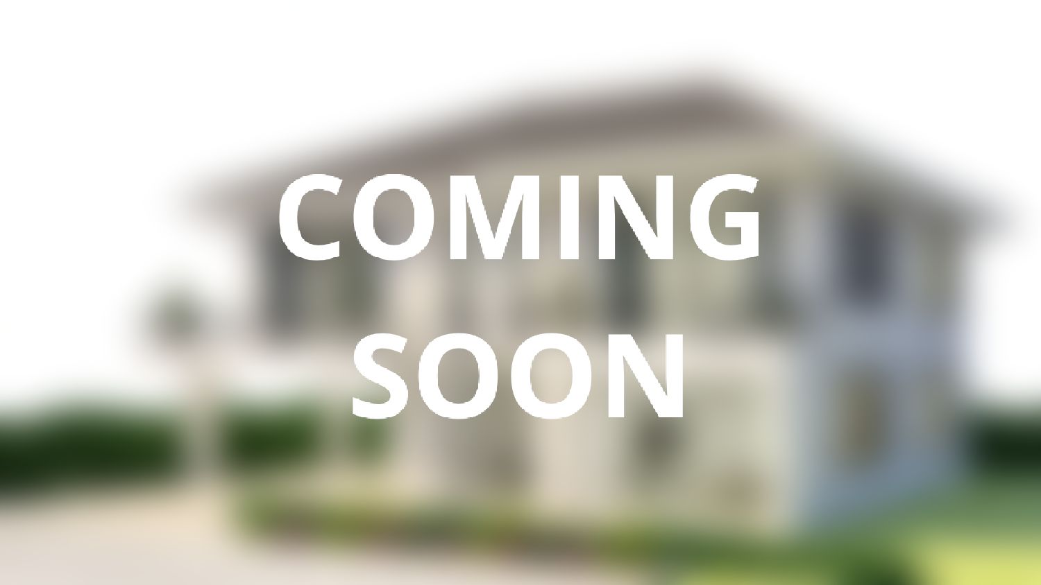A blurry picture of a house with the words `` coming soon '' written on it.