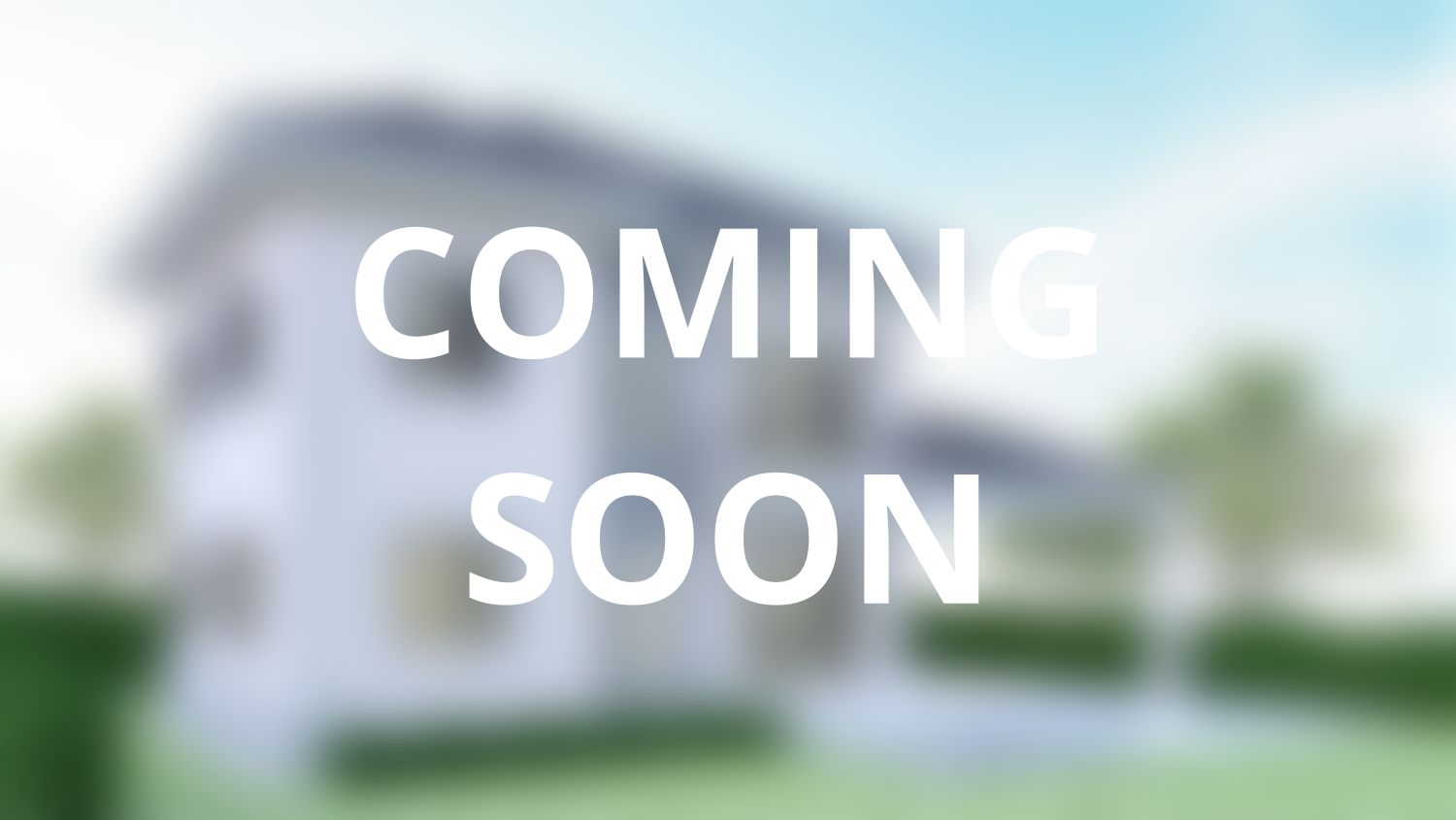 A blurry picture of a house with the words `` coming soon '' written on it.