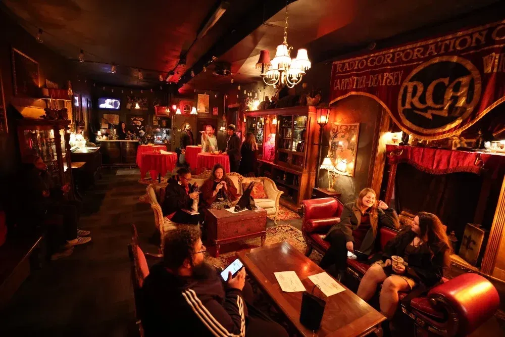 Restaurant with dark colors and dim lighting.