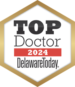 A badge that says top doctor 2024 delaware today