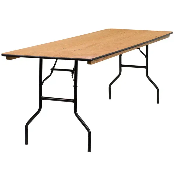 Foldable wooden table with black metal legs on a white background