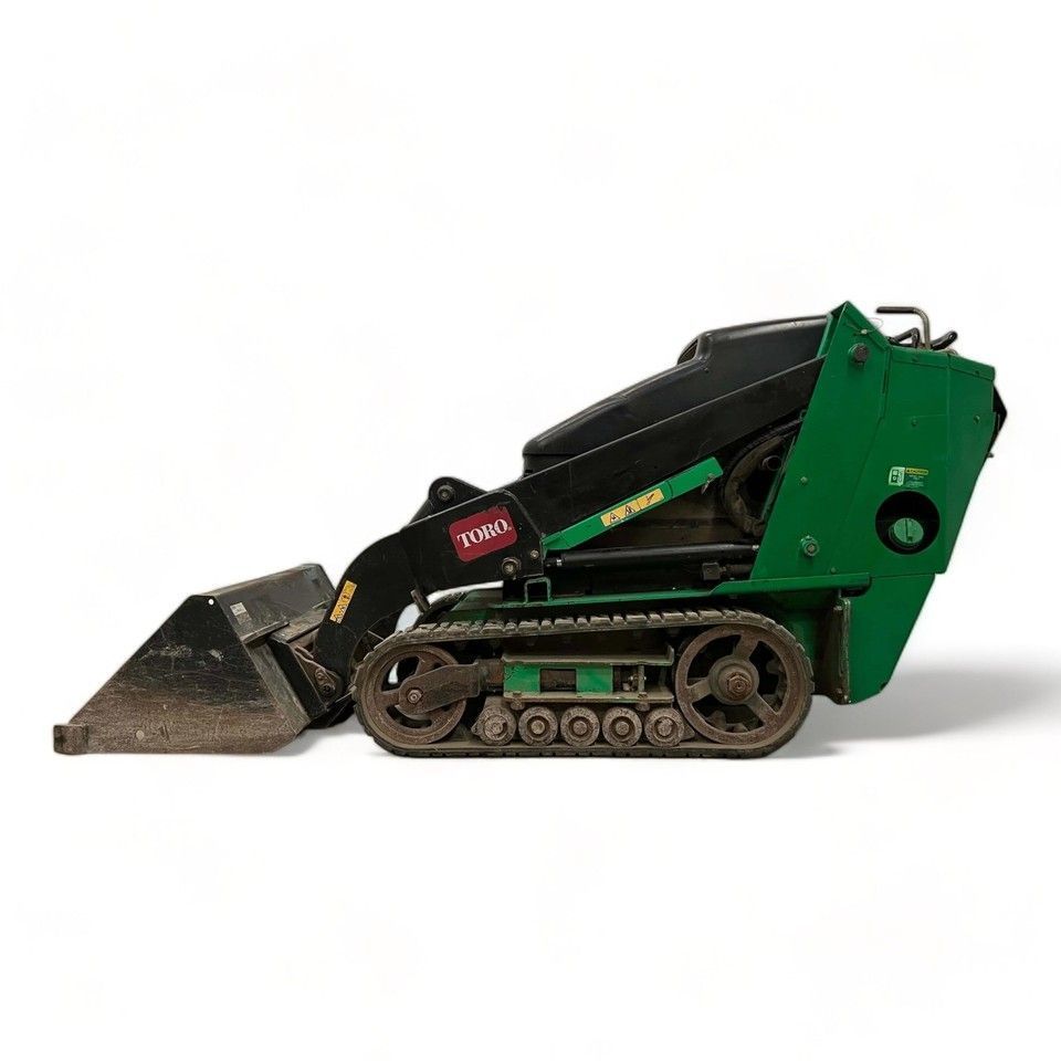 Green compact track loader with front bucket, shown on a white background.