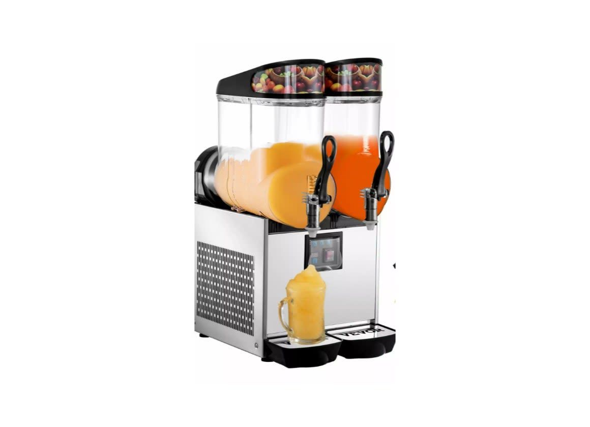 Frozen drink machine with orange slush in clear tanks and a filled cup on the drip tray
