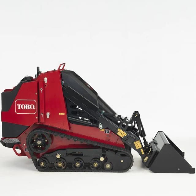 Red Toro skid-steer loader with bucket, side view on white background