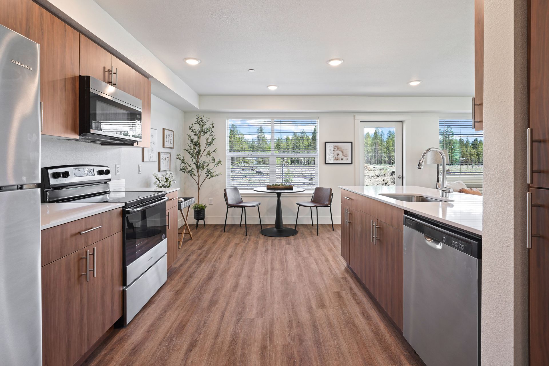 A kitchen with stainless steel appliances and wooden cabinets