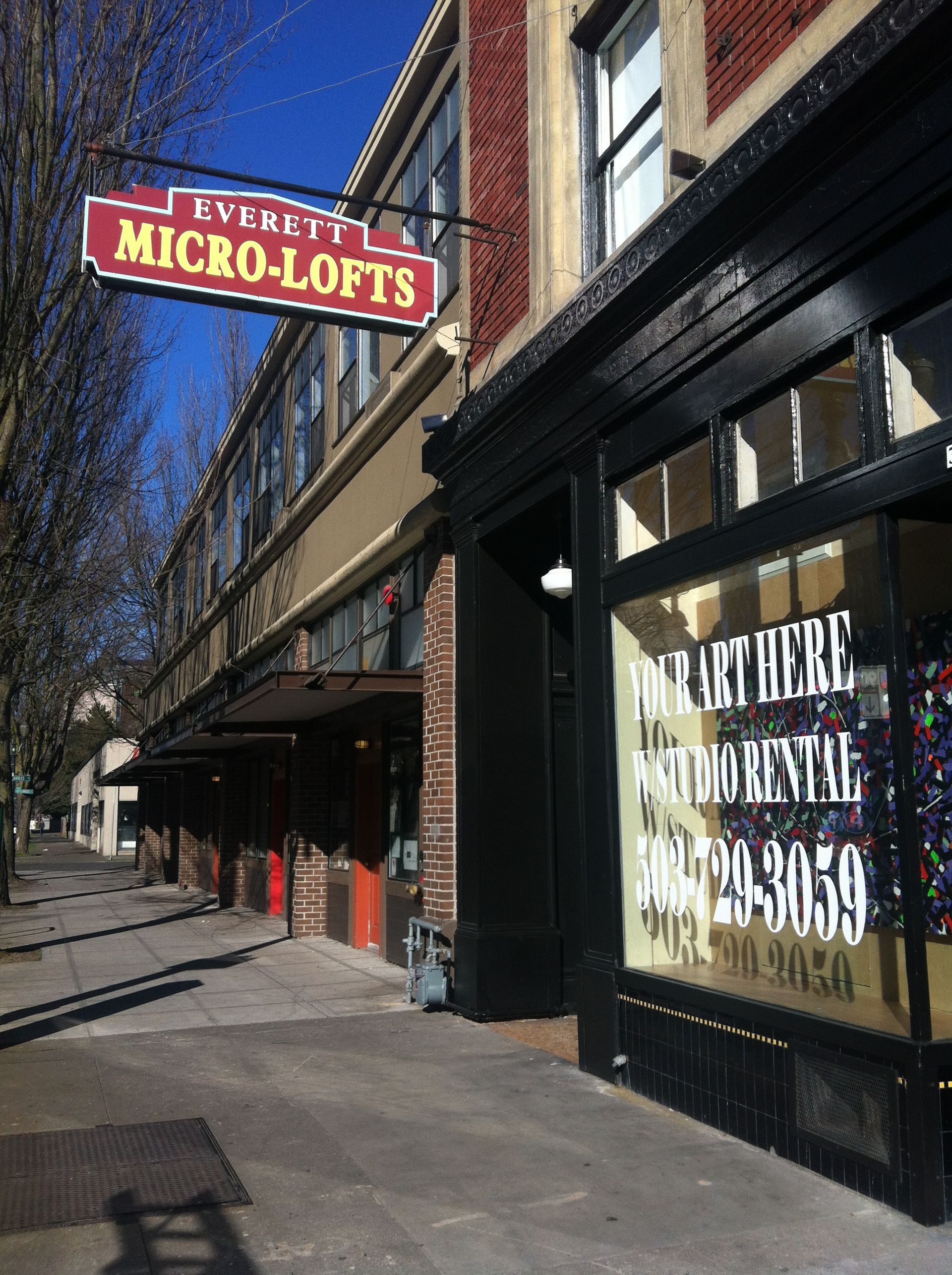 A building with a sign that says micro lofts on it