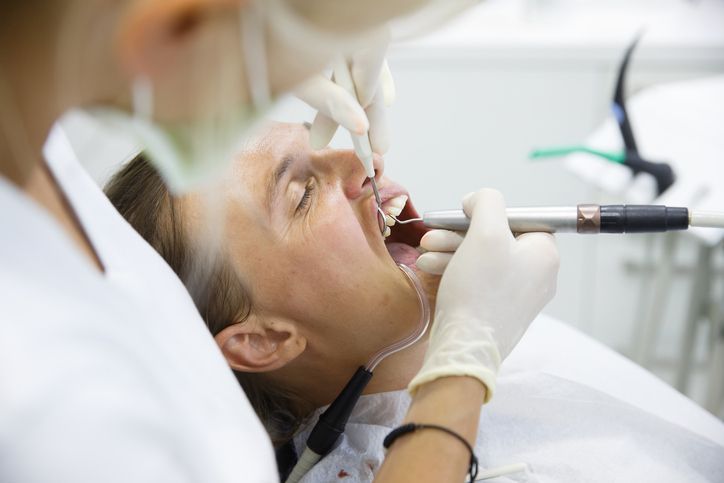 A dentist working on a patient