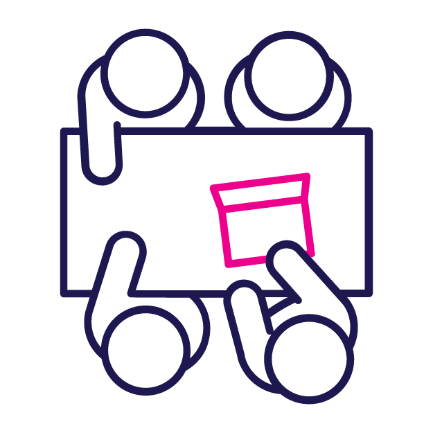Four people around a table, one hand touches a pink box, teamwork.